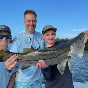 Snook inshore fishing charters on ami Happy Family with a large snook